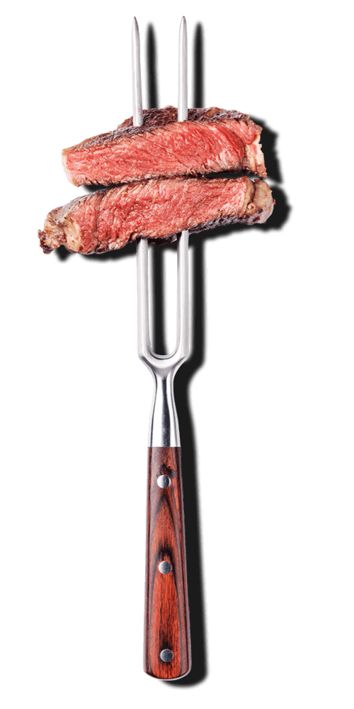 Medium cooked steak on a fork.